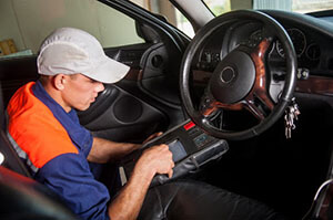 the mechanic works on the steering wheel