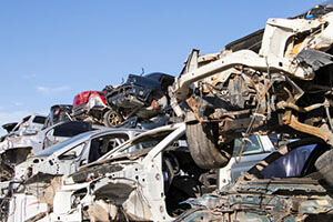 dismantled cars stacked on top of each other